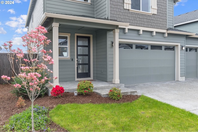 view of exterior entry featuring a garage