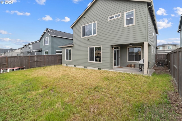 rear view of property with a patio area and a lawn