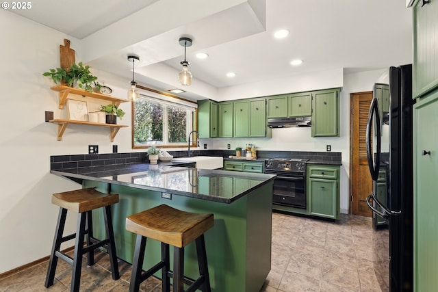 18735 NE Wasco Ct, Portland, OR 97230 - kitchen featuring green cabinets, a peninsula, black appliances, a sink, and recessed lighting