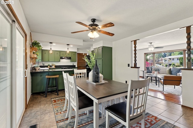 18735 NE Wasco Ct, Portland, OR 97230 - dining room featuring ceiling fan and light tile patterned floors