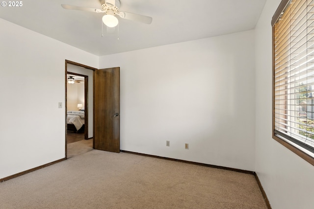 18735 NE Wasco Ct, Portland, OR 97230 - empty room with light colored carpet, ceiling fan, and baseboards