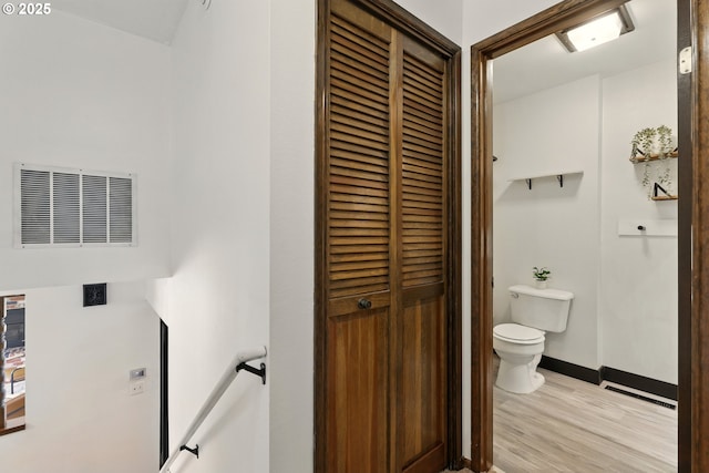 18735 NE Wasco Ct, Portland, OR 97230 - bathroom with toilet, wood finished floors, a closet, and baseboards