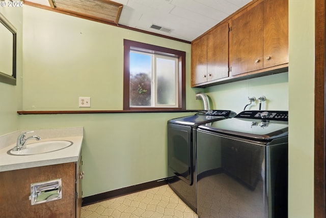18735 NE Wasco Ct, Portland, OR 97230 - washroom featuring washer and dryer, cabinet space, and baseboards