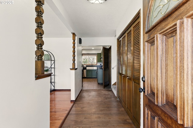 18735 NE Wasco Ct, Portland, OR 97230 - hall featuring dark wood-style floors and baseboards