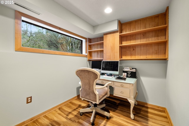 home office featuring baseboards, visible vents, wood finished floors, and recessed lighting