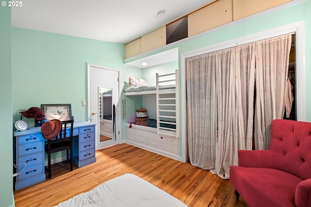 bedroom with wood finished floors