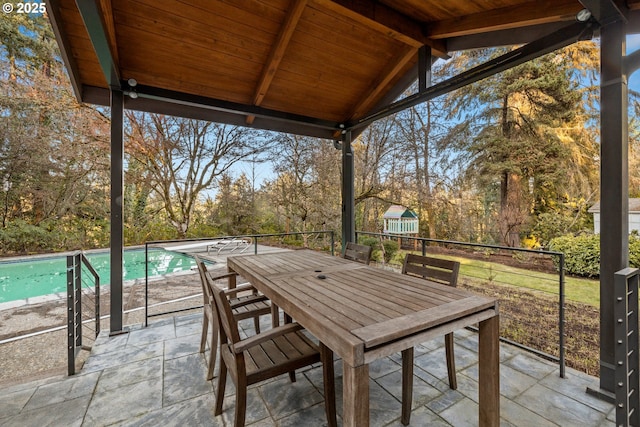 view of patio featuring outdoor dining area and an outdoor pool