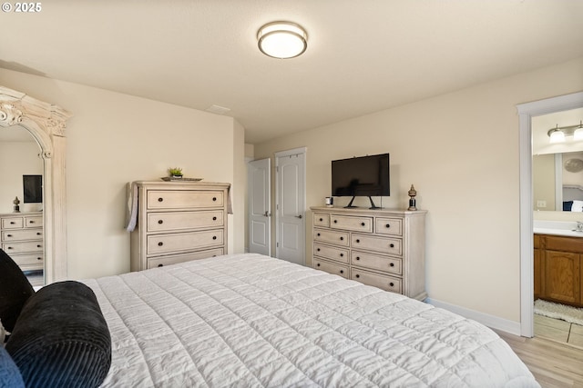1894 S 8th St, Cottage Grove, OR 97424 - bedroom featuring light wood-style flooring and ensuite bathroom