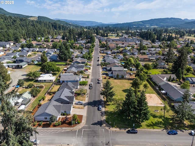 1894 S 8th St, Cottage Grove, OR 97424 - aerial overview of property's location featuring mountains and nearby suburban area