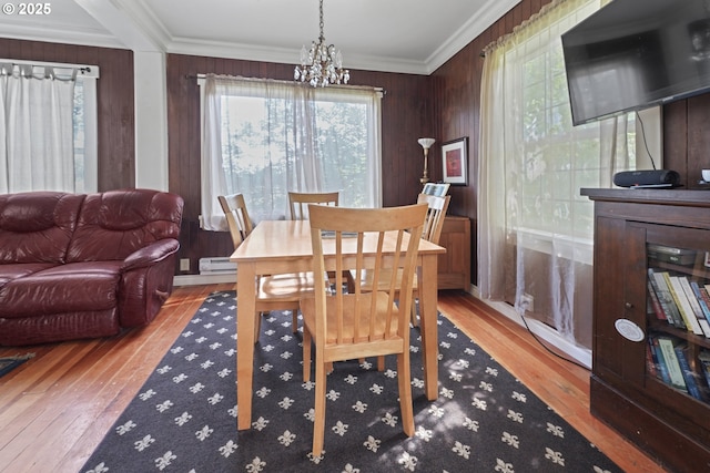 5450 Mill Creek Rd, The Dalles, OR 97058 - dining room with a chandelier, hardwood / wood-style floors, plenty of natural light, ornamental molding, and wooden walls