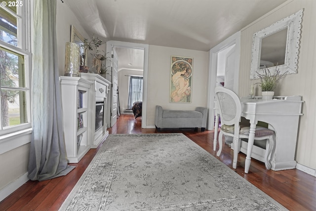 5450 Mill Creek Rd, The Dalles, OR 97058 - living room featuring dark wood-type flooring, a glass covered fireplace, and baseboards