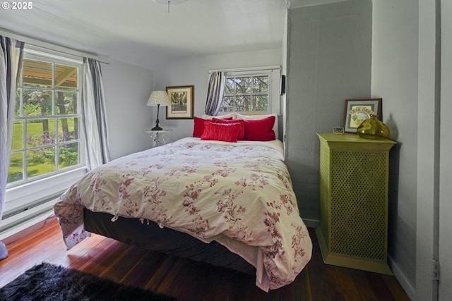 5450 Mill Creek Rd, The Dalles, OR 97058 - bedroom featuring wood finished floors, vaulted ceiling, and baseboard heating