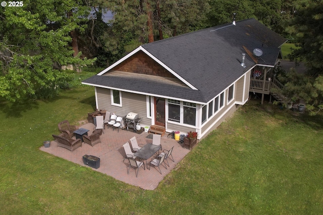 5450 Mill Creek Rd, The Dalles, OR 97058 - rear view of house with roof with shingles, entry steps, a patio, a yard, and an outdoor hangout area
