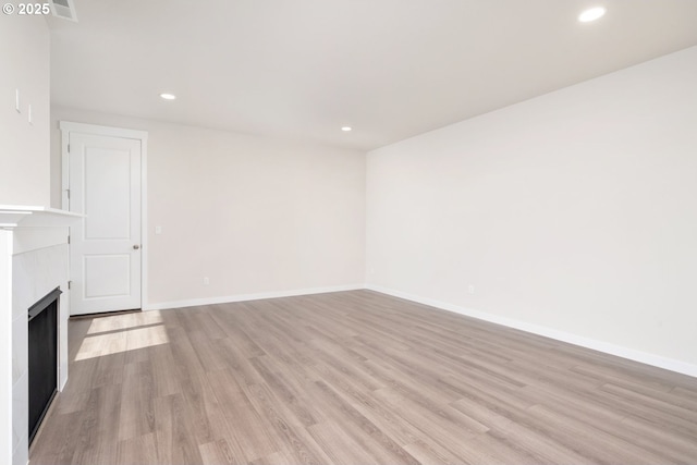 3020 S Kodiak St Unit Lt811, Cornelius, OR 97113 - unfurnished living room with light wood-style flooring, recessed lighting, and a fireplace