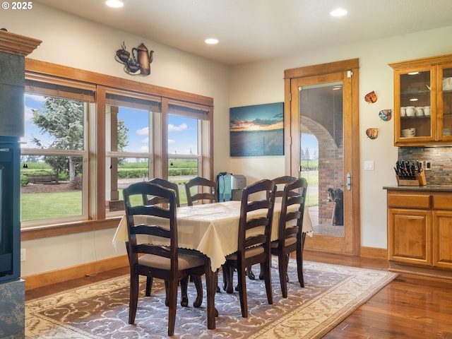 dining area with a healthy amount of sunlight, baseboards, recessed lighting, and wood finished floors