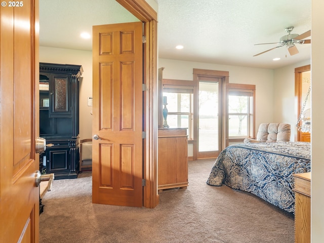 carpeted bedroom featuring recessed lighting and a ceiling fan