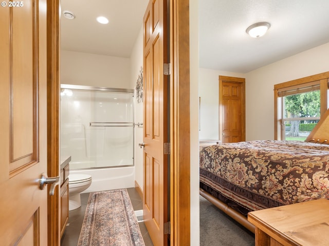 bedroom featuring dark tile patterned flooring, ensuite bathroom, and recessed lighting