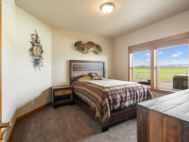 bedroom with baseboards and carpet flooring
