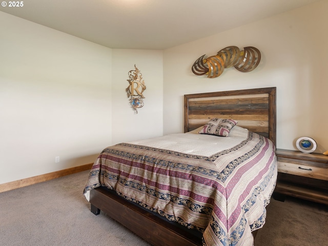 carpeted bedroom featuring baseboards