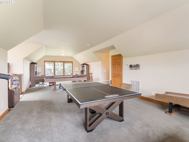 rec room with visible vents, baseboards, lofted ceiling, and light colored carpet
