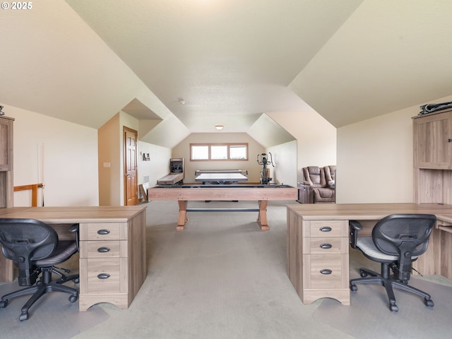 office space with light colored carpet and vaulted ceiling