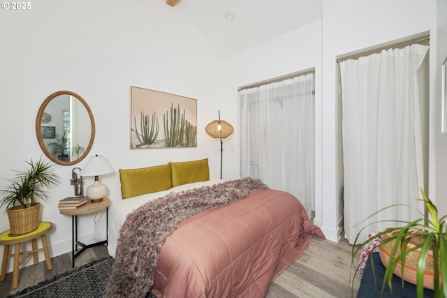 7228 N Villard Ave, Portland, OR 97217 - bedroom featuring wood finished floors and high vaulted ceiling