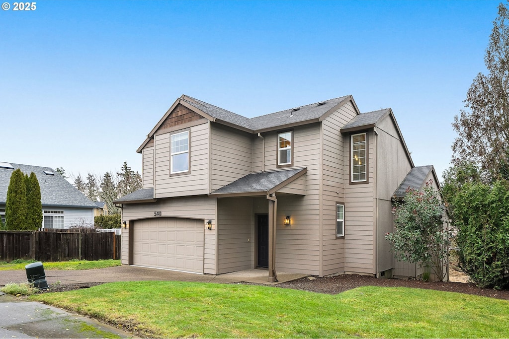 front of property with a garage and a front lawn