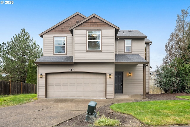 view of front of home with a front lawn and a garage