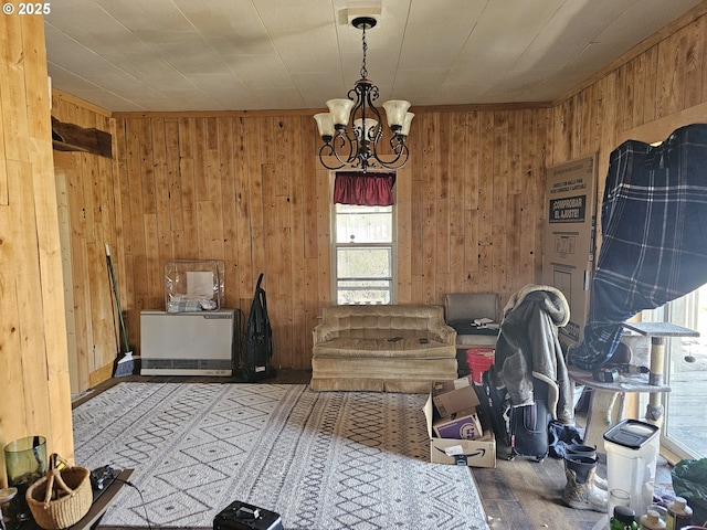 54901 Willow St, Heppner, OR 97836 - dining space with wooden walls, a chandelier, and wood finished floors
