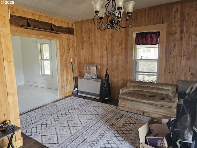 54901 Willow St, Heppner, OR 97836 - sitting room with wooden walls, a chandelier, and wood finished floors