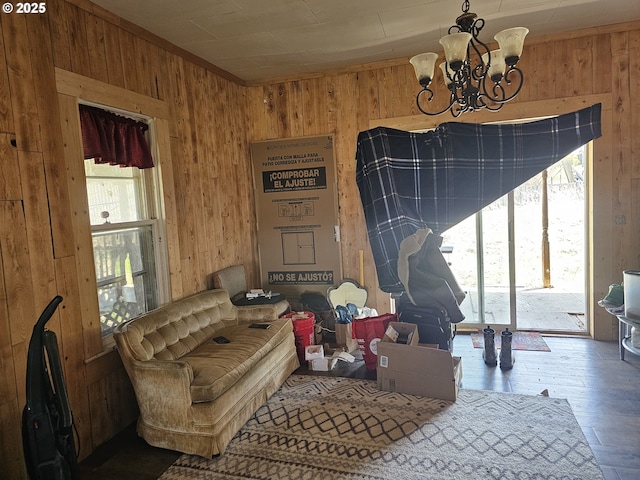 54901 Willow St, Heppner, OR 97836 - sitting room featuring wooden walls, a chandelier, and hardwood / wood-style floors