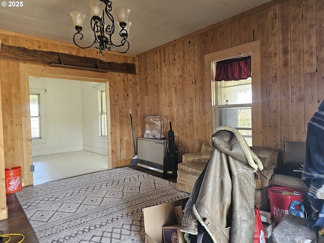 54901 Willow St, Heppner, OR 97836 - dining space featuring wood walls, wood finished floors, and a chandelier