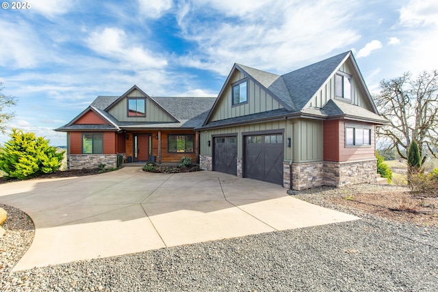 craftsman-style home with stone siding, board and batten siding, concrete driveway, and roof with shingles