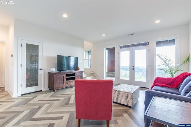 living room with visible vents, recessed lighting, french doors, and baseboards