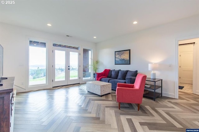 living area with recessed lighting, french doors, baseboards, and visible vents