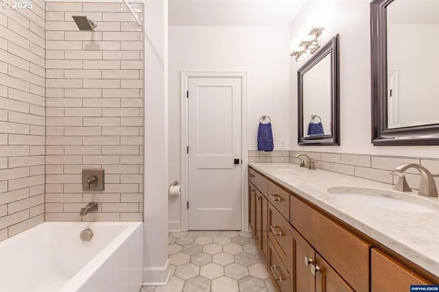 full bath featuring double vanity, tile patterned floors, bathtub / shower combination, and a sink