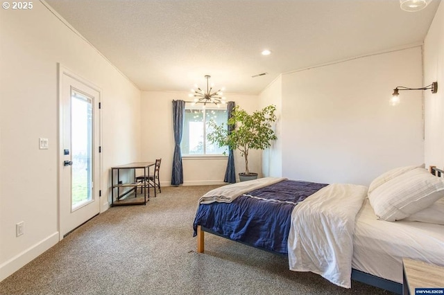 bedroom with baseboards, an inviting chandelier, ornamental molding, and carpet flooring