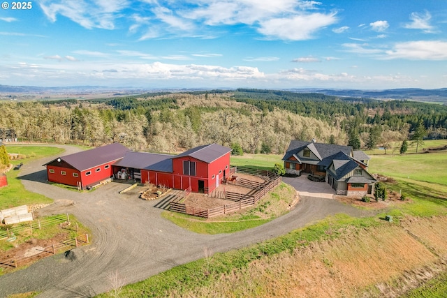 drone / aerial view with a rural view and a wooded view