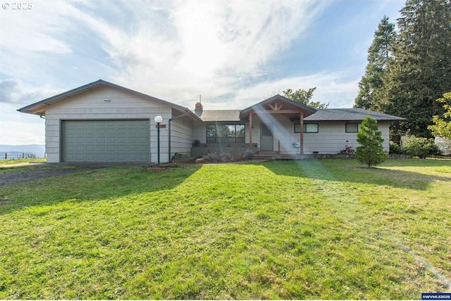 ranch-style home with a front yard, an attached garage, driveway, and a chimney