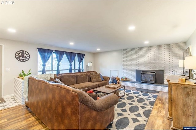 living room featuring recessed lighting, wood finished floors, and baseboards