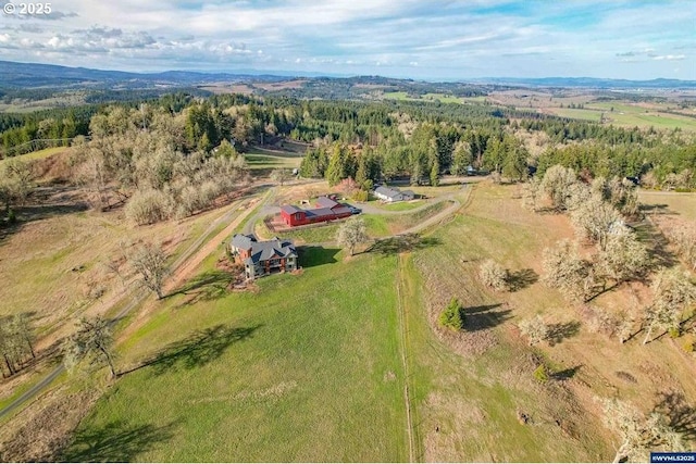 drone / aerial view with a rural view and a forest view