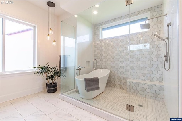 bathroom with recessed lighting, baseboards, a freestanding bath, and a shower stall