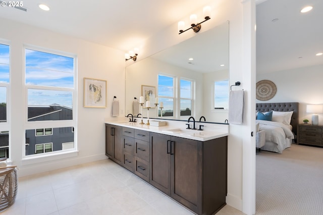 310 W Fir Loop, Washougal, WA 98671 - bathroom featuring double vanity, connected bathroom, tile patterned flooring, baseboards, and recessed lighting