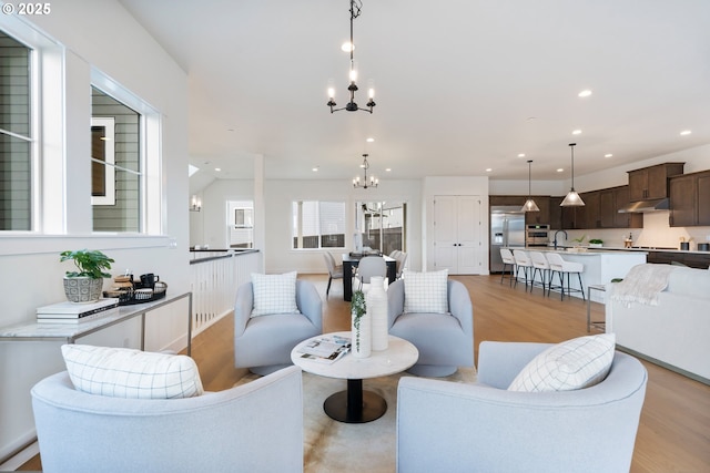 310 W Fir Loop, Washougal, WA 98671 - living room with a chandelier, light wood-type flooring, and recessed lighting