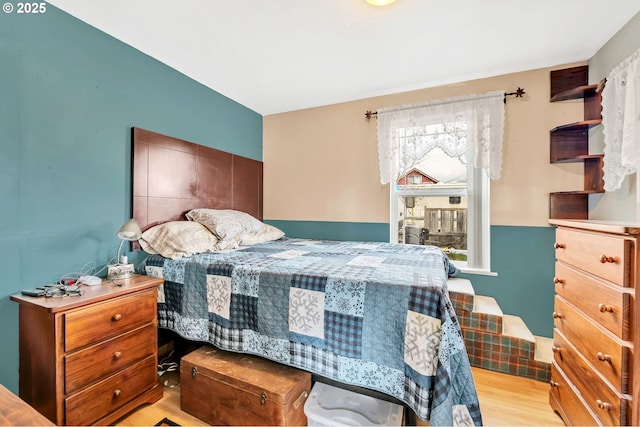 bedroom featuring wood finished floors