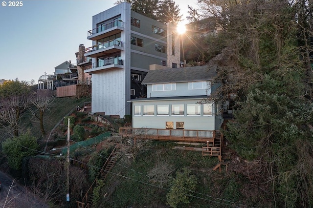 view of back house at dusk