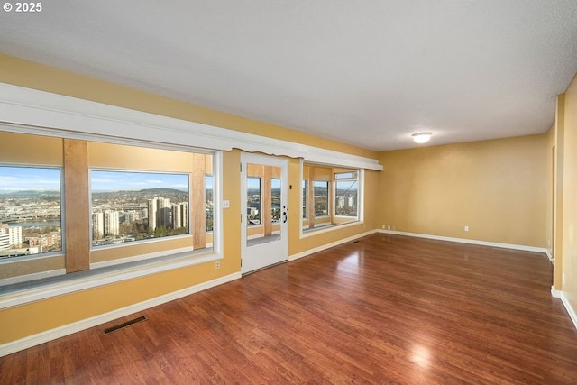 spare room featuring hardwood / wood-style flooring