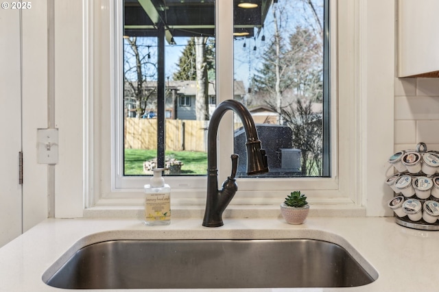 details with a sink and light countertops