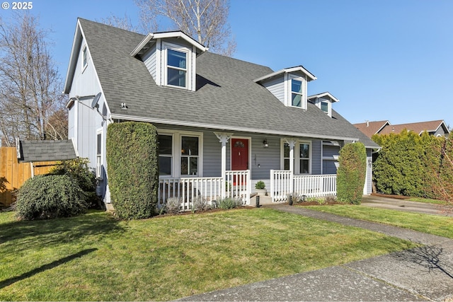 cape cod-style house featuring a garage, covered porch, a shingled roof, and a front lawn