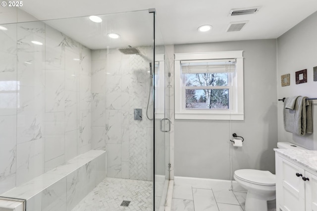 bathroom with vanity, baseboards, a marble finish shower, toilet, and marble finish floor